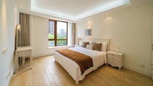 A bedroom with a large bed, bedside tables, a nightstand, a window with a view of buildings, and a ceiling light. - Tyms Gubei International Plaza 3BR Apt (Shanghai)