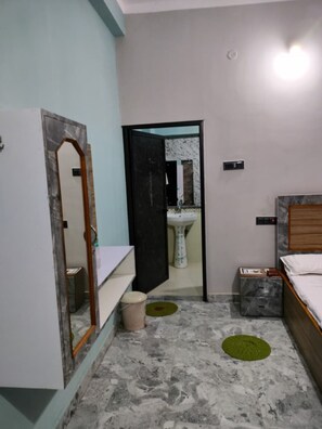 Habitación Deluxe | Baño | Ducha y toallas