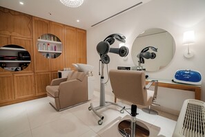 A modern hair salon with a hairdryer, mirror, and seating area. - Luxury Villa Katino Estate with Private Pool & Sea Views (Šipanska Luka)