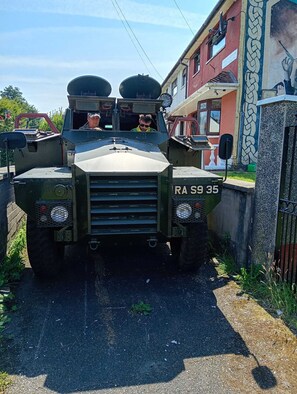 A military vehicle with a license plate RA S9 35 parked on a street. - BridAj's Place is a full Semi-detached 3 Bed home with parking full of History. (Belfast)