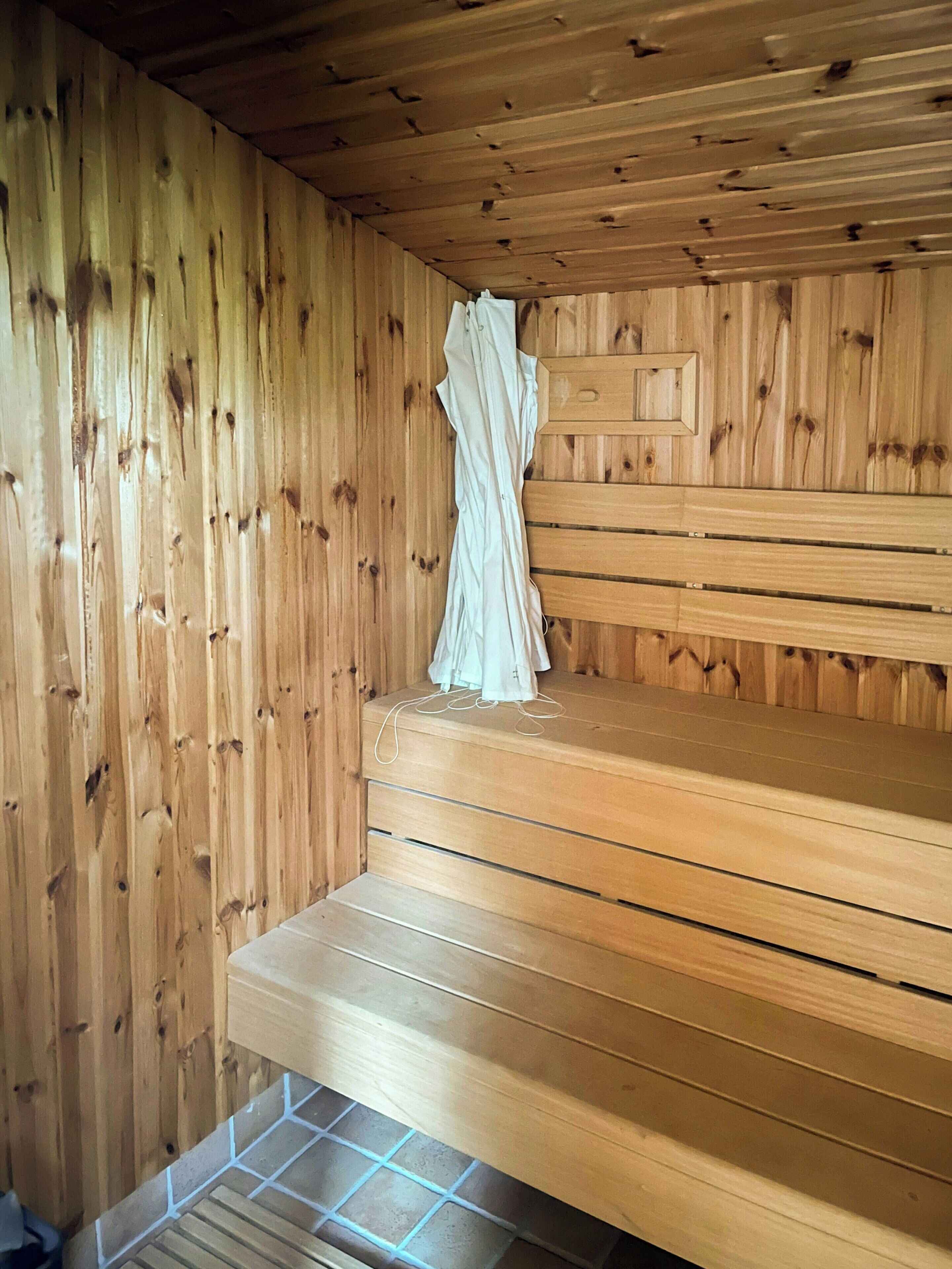 A sauna with wooden walls and benches.