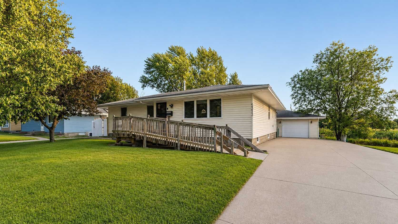 A single-story house with a front porch and a garage.