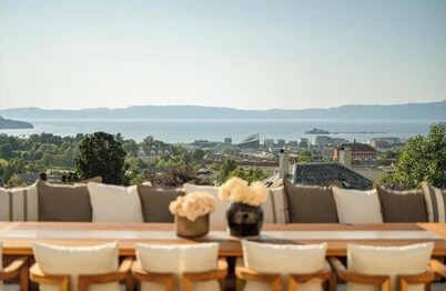 Exclusive fjord views from a modern penthouse apartment with a terrace and free parking
