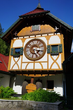 A traditional building with a large clock on the facade, wooden beams, and a steeply pitched roof. - Modern Black Forest vacation rental for up to 5 people with an elevator. Pet-friendly! (Bad Peterstal-Griesbach)
