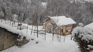 A snow-covered landscape with a house and trees. - Apartment with Balconies (sleeps 6) (Saint-Michel-de-Maurienne)