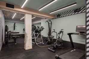 A gym with various exercise equipment, including treadmills and weight machines. - Noctilia Athens (Athens)