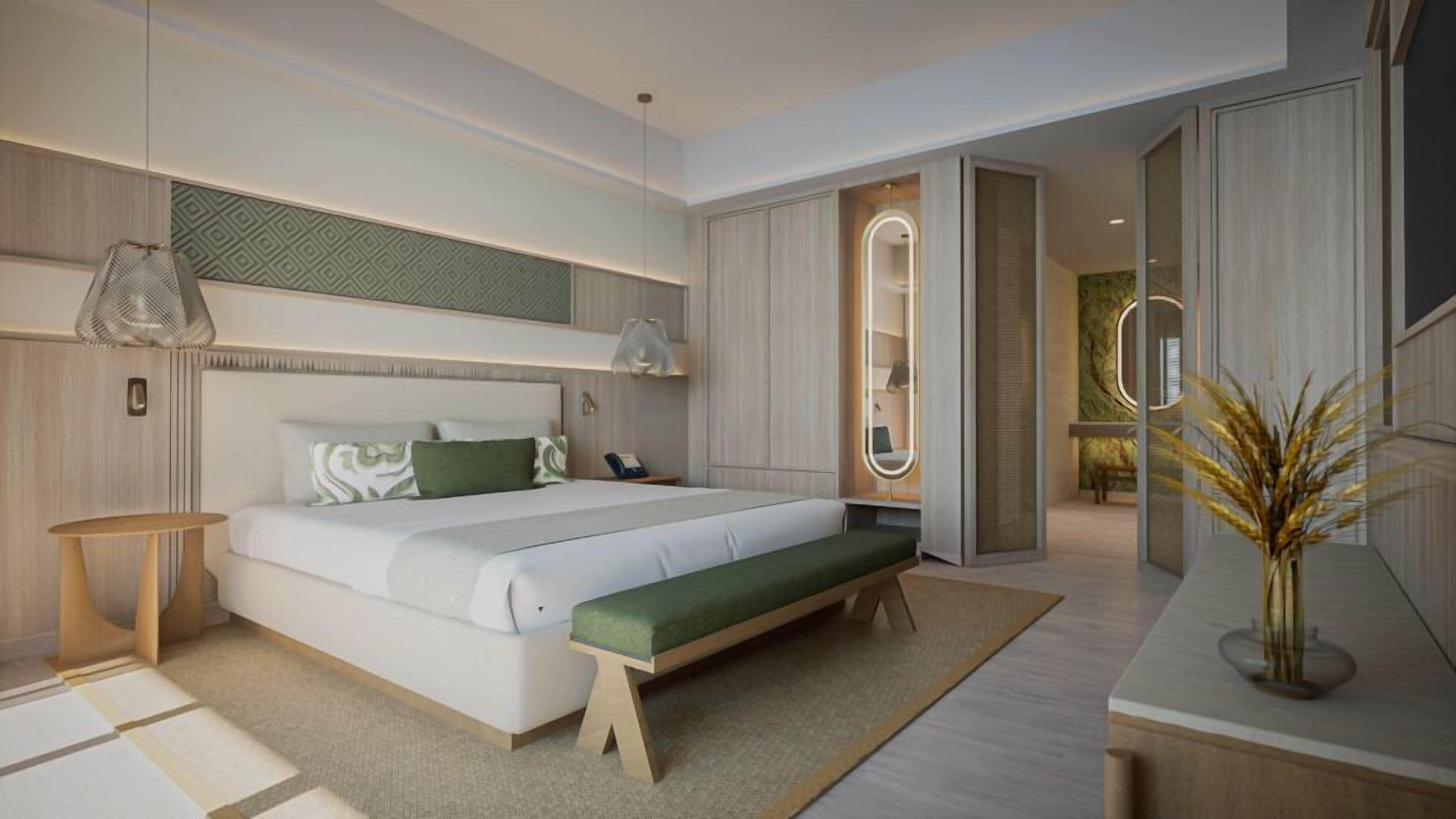 A modern bedroom with a large bed, bedside tables, a bench, and a mirror.