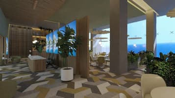 A modern interior with a geometric patterned floor, a reception desk, seating area, and large windows with a view.
