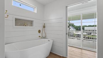 Shower, hair dryer, towels, toilet paper
