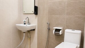 A bathroom with a toilet, sink, and shower. - The Shree Heritage And Rooftop (Bara Banki)