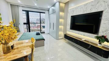 Deluxe Apartment, Balcony, City View | Living area | 40-inch Smart TV with digital channels, Netflix, streaming services