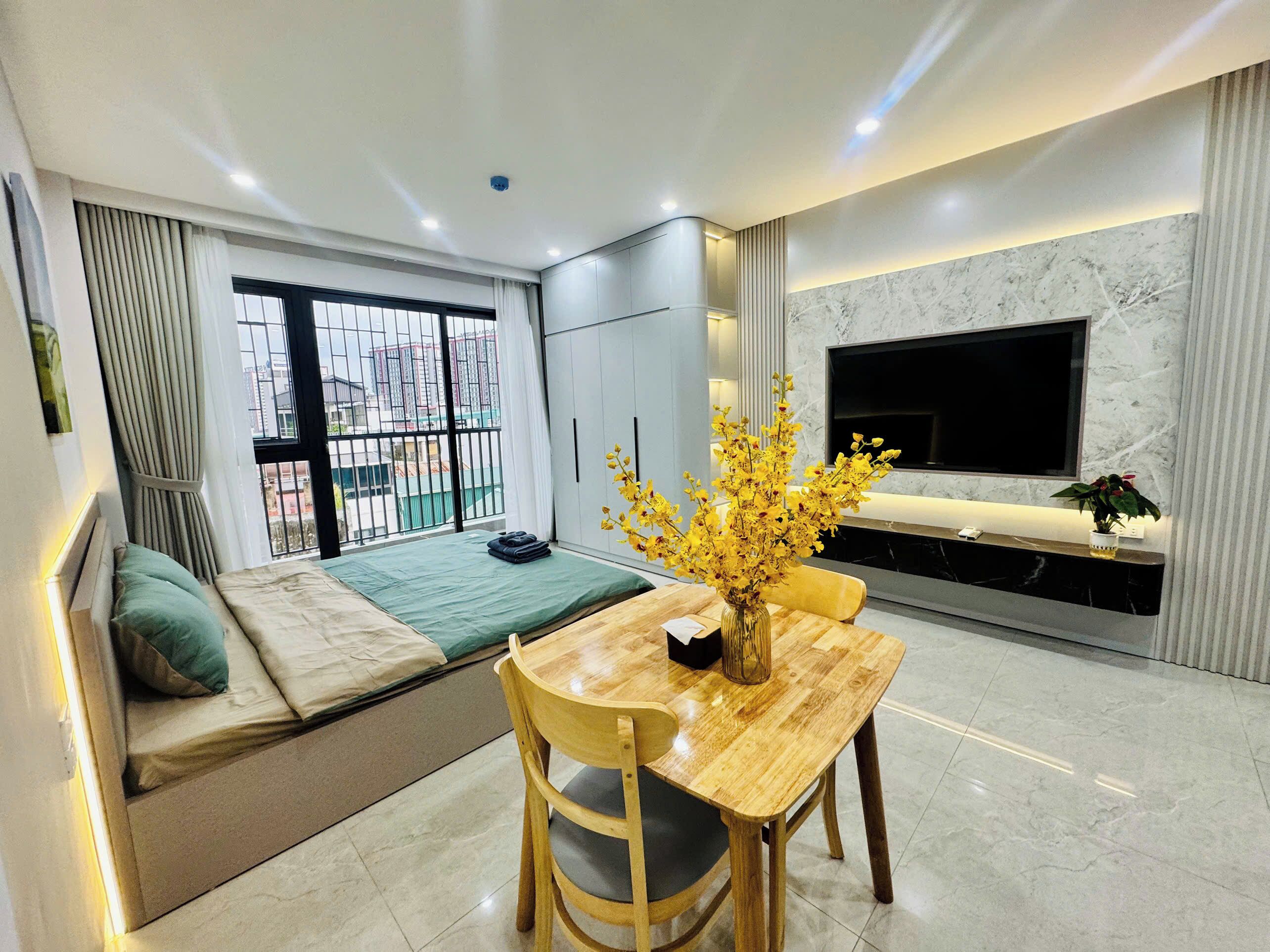 Deluxe Apartment, Balcony, City View | Desk, laptop workspace, blackout drapes, soundproofing