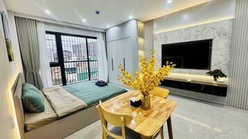 Deluxe Apartment, Balcony, City View | Desk, laptop workspace, blackout drapes, soundproofing