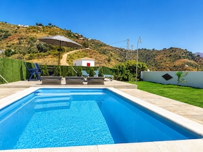 A swimming pool with lounge chairs and a view of a hilly landscape. - Juan De Dios Farmhouse (Cómpeta)
