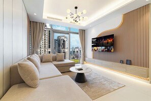 Departamento Deluxe, vista a la ciudad | Área de sala de estar