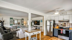 A modern kitchen with a stainless steel refrigerator, a built-in oven, and a wooden countertop. - Walk to Beach & Marinas! Brigantine 2-unit Duplex (Brigantine)