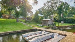 A lakeside property with a dock, floating docks, and a small cabin. - Dock & Outdoor Bar! Lake Blackshear Getaway (Cobb)