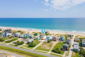 A coastal residential area with houses, a beach, and a clear sky. - Spectacular Sunrises, Pool, Hot Tub, Theater Room, Office, SN9317 (Nags Head)