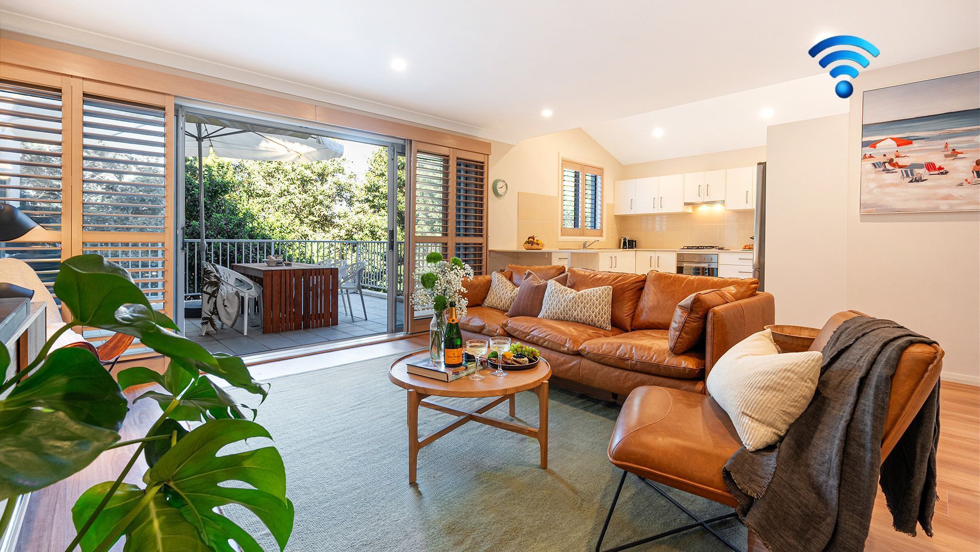 Kiama Central Townhouse | Living room (upstairs) | Smart TV | Split cycle air conditioning upstairs | Open plan living space with kitchen and dining room | Uncovered patio with BBQ and alfresco dining 
