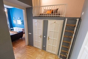 A room with a bunk bed, a wardrobe, and a door with a rope ladder. - MidTerm - Chic Soho Apartment near Opera (Budapest)