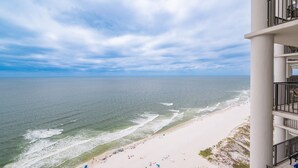 A beach view from a balcony with a clear sky and ocean. - The Oasis 2609 Formerly Phoenix West Ii 2609 3 Bedroom Condo (Orange Beach)