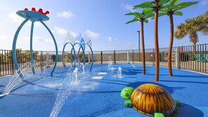 A water play area with multiple water jets and a turtle-shaped play structure. - The Oasis 3006 Formerly Phoenix West Ii 3006 3 Bedroom Condo (Orange Beach)