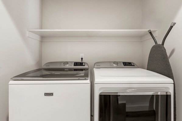A laundry room with two Maytag washing machines and a drying rack. - Beso Del Sol 4 Bedroom Townhouse (St. George)