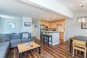A modern apartment with a living room, kitchen, and dining area. - Sunset Vista 3 Bedroom Condo (Telluride)