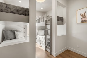 A modern interior with a bunk bed, a ladder, and a framed picture on the wall. - Beso del Sol: Desert Color Lagoon + Golf Cart! (St. George)