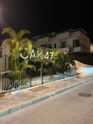 A building with a sign that reads 'CAK47' illuminated at night. - 3 Bed Townhouse Escape Costa Del Sol - Pass the Keys (Fuengirola)