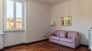 Living area - An elegant 75 sqm apartment, ideal for 4 people, located on the 6th and top floor of a building with an elevator (NOT accessible to people with disabilities).The Lodi metro station is just a 4-minute walk away, making it easy to get around the capital. (Rome)