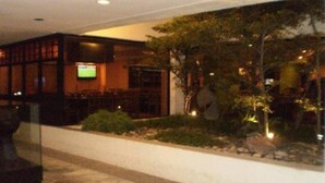 A lobby with a reception desk, seating area, and a television screen. - Eurobuilding Hotel and Suites Caracas (Caracas)