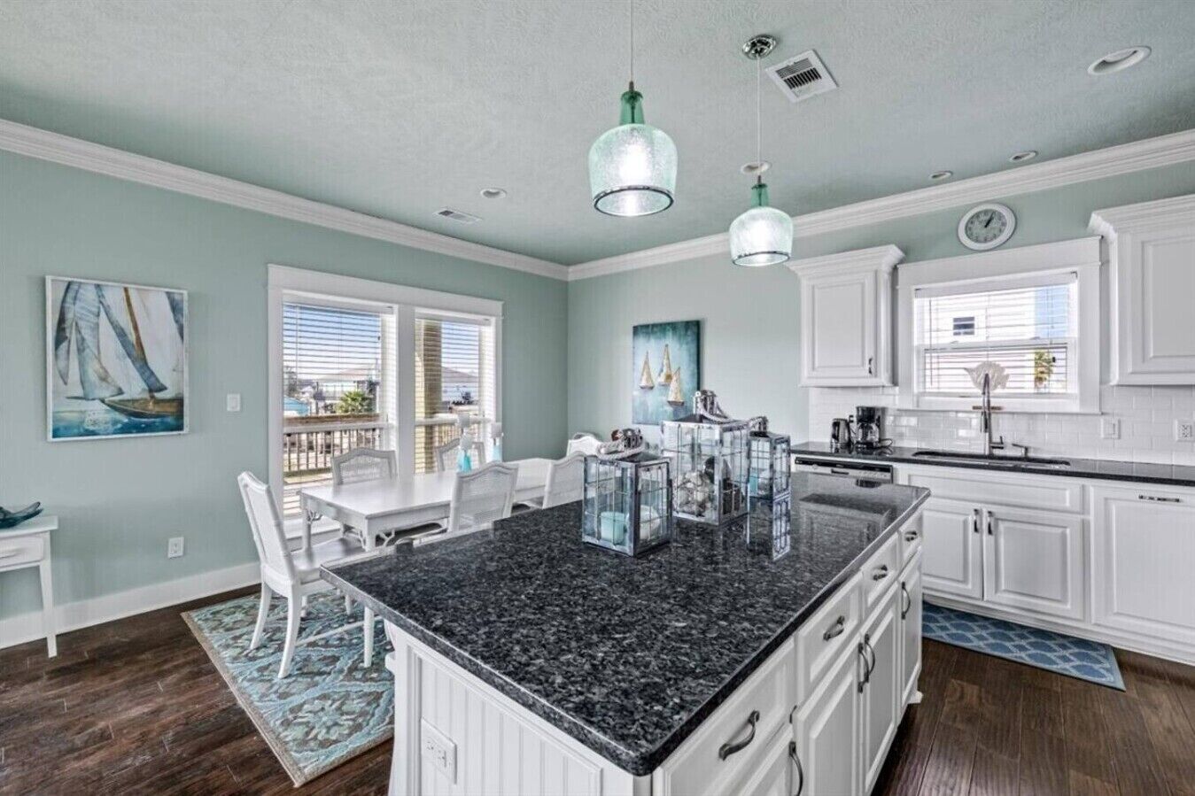 Kitchen island and dining area by the windows