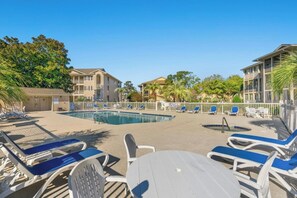 A pool area with lounge chairs and a small pool. - Tilghman Shores I6- 2 Bedroom- Pool, Hot Tub (North Myrtle Beach)