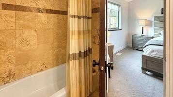 Shower, hair dryer, towels, shampoo