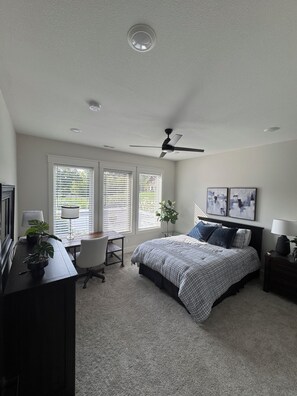 A bedroom with a bed, desk, chair, and ceiling fan. - MIZ-ZOU football weekend home
Awesome  house on Hole #7 at Old Hawthorne (Columbia)