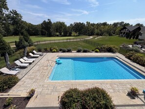 A rectangular swimming pool with a tiled deck, surrounded by lounge chairs and potted plants. - MIZ-ZOU football weekend home
Awesome  house on Hole #7 at Old Hawthorne (Columbia)