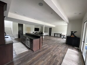 A spacious kitchen with a central island, wooden flooring, and a modern design. - MIZ-ZOU football weekend home
Awesome  house on Hole #7 at Old Hawthorne (Columbia)