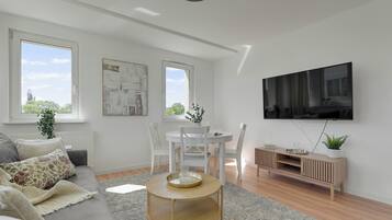 Apartamento econômico, para não fumantes, banheiro privativo | Área de estar | TV de tela plana 40 polegadas com canais a cabo, Netflix, Hulu