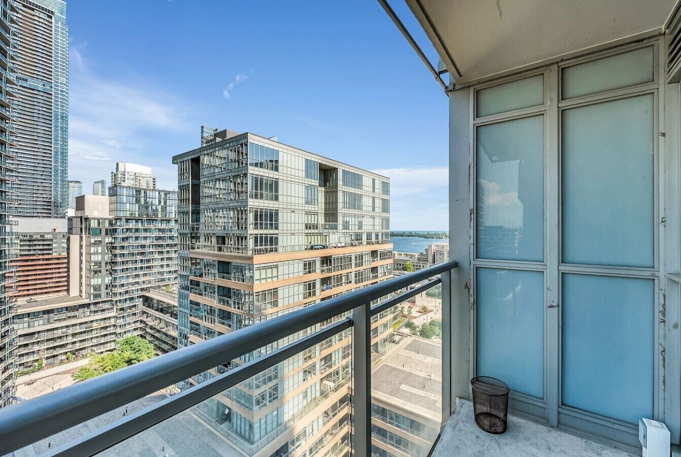 Step onto your private high-rise balcony to take in sweeping architectural and water views while enjoying a quiet glass of wine in the evening breeze.