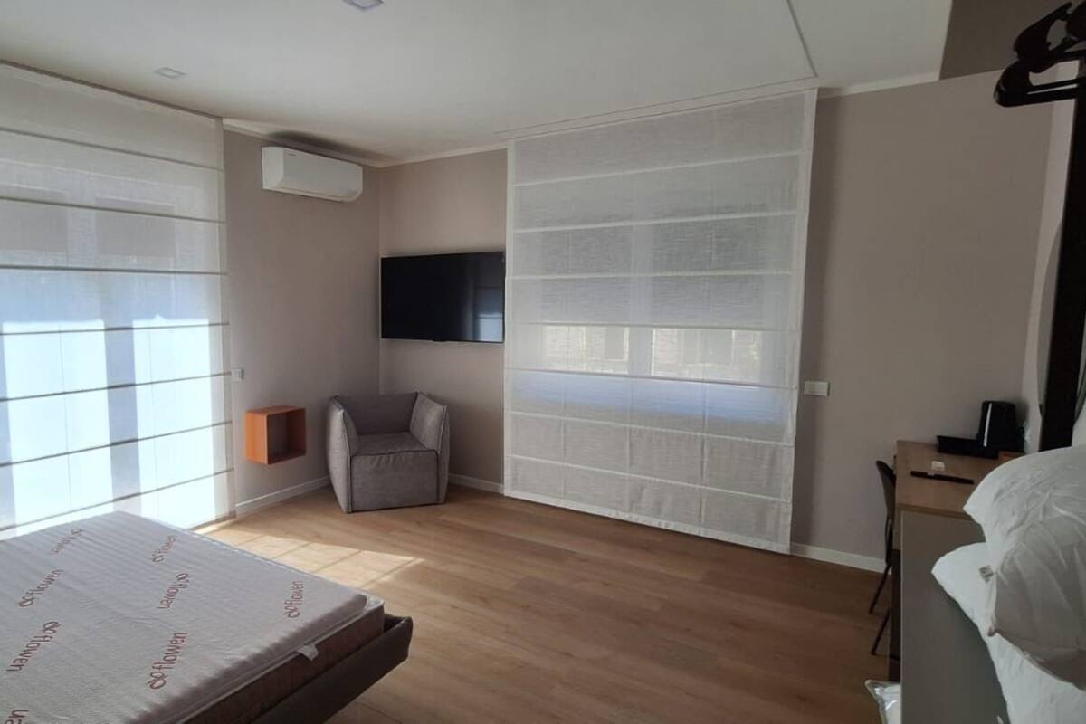 Deluxe Room, Balcony | In-room safe, desk, laptop workspace, soundproofing