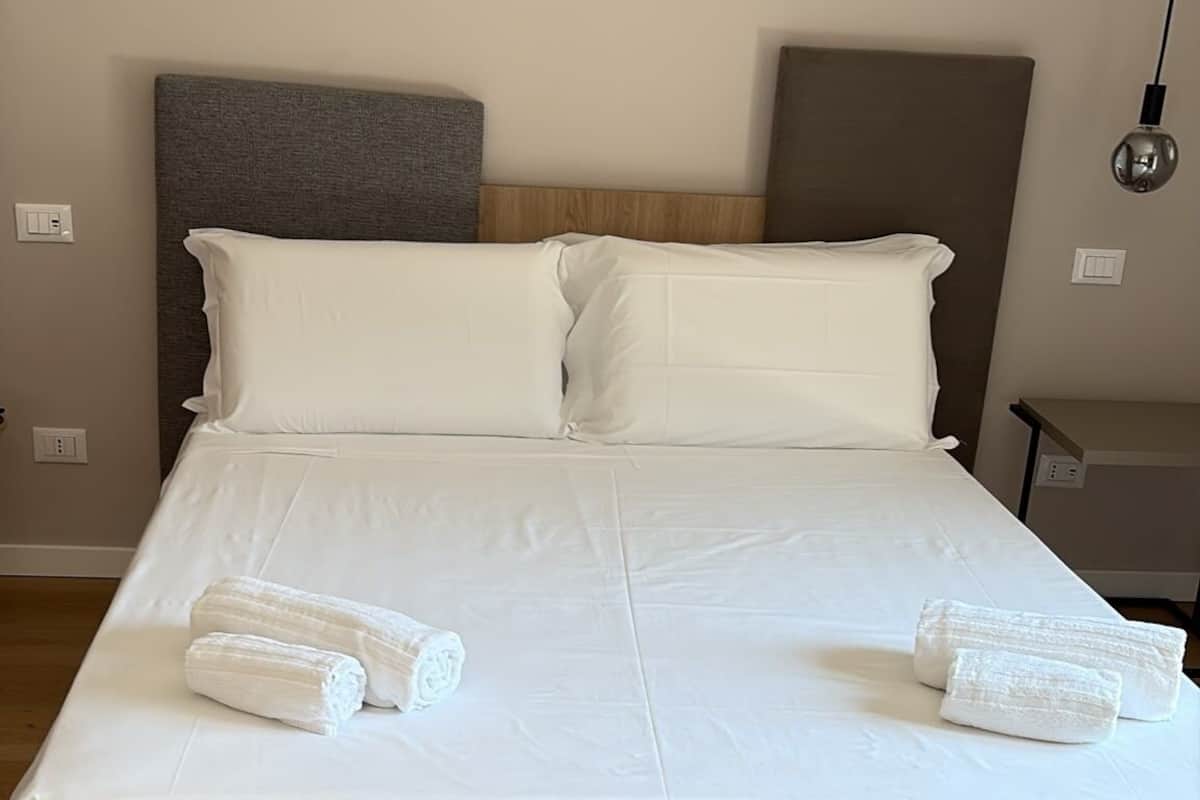 Deluxe Triple Room, Balcony, City View | In-room safe, desk, laptop workspace, soundproofing