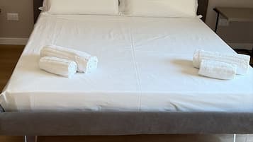 Deluxe Triple Room, Balcony, City View | In-room safe, desk, laptop workspace, soundproofing