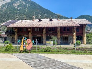 A historic train station with a large wooden building, multiple windows, and a sign that reads 'MORGEX'. - Apartment Ilda by Interhome (Morgex)