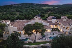 A large estate with multiple buildings, a swimming pool, and a landscaped garden. - Blanco River estate + 2 pools + court (Wimberly)