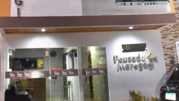 A multi-story building with a sign that reads 'Pousada Maragogim.' - POUSADA VIVA MARAGOGI (Maragogi)