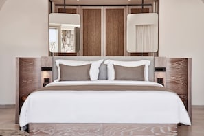 A modern bedroom with a large bed, wooden headboard, and two bedside tables. - Avenithion Suite, Divine Sea Views, Private Pool, Furnished Terrace, Sanrotini (Santorini)