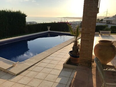 Panoramic views of the sea, harbor, and mountains. 500m from the beach