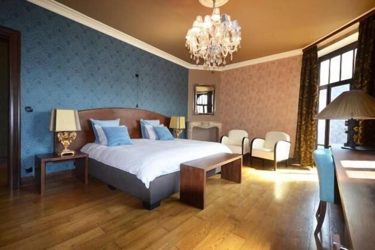 Deluxe Suite, Balcony, City View | Minibar, in-room safe, desk, laptop workspace