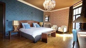 Deluxe Suite, Balcony, City View | Minibar, in-room safe, desk, laptop workspace